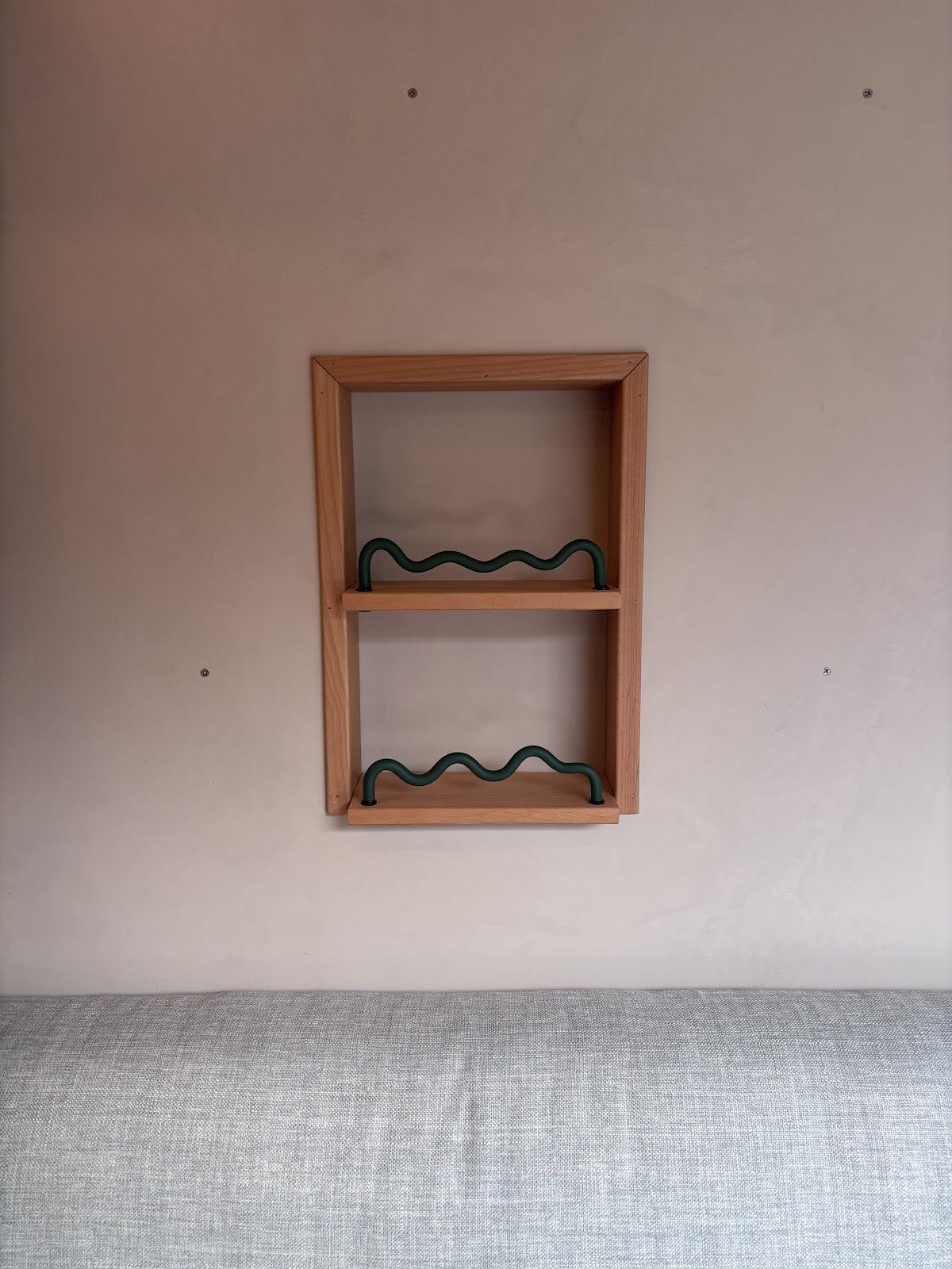 Wall storage nook above the bench