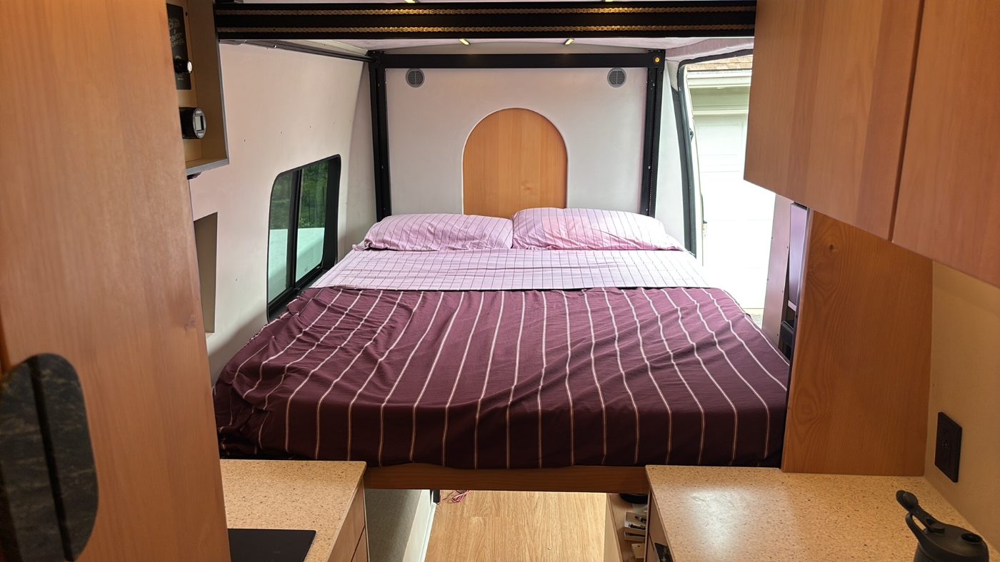 The bed, with the arched bulkhead behind