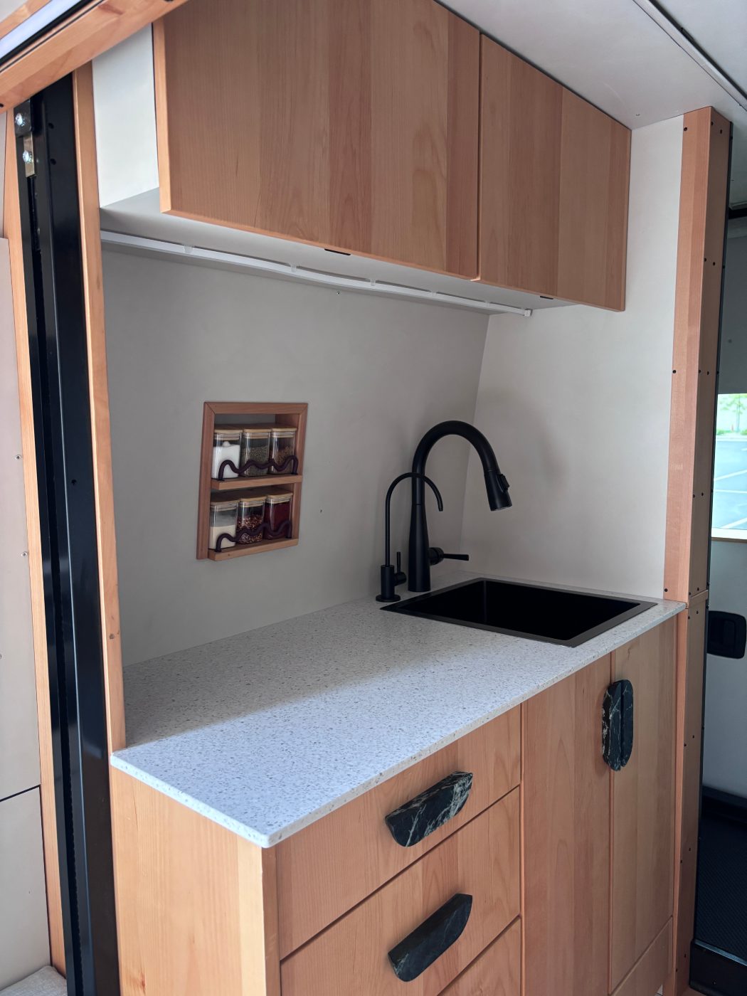 The kitchen, Corian counter and black faucet